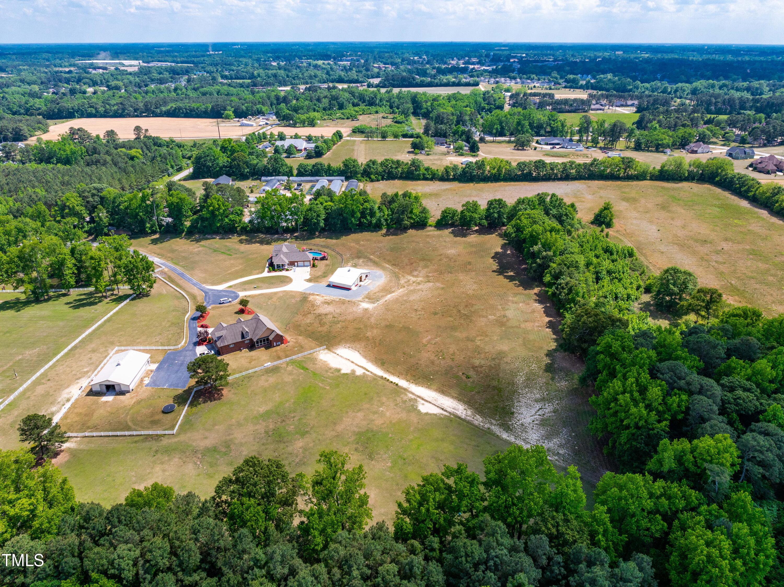 115 Three M Trail Benson, NC 27504 - Photo 70 of 80 an aerial view of a city with lake view