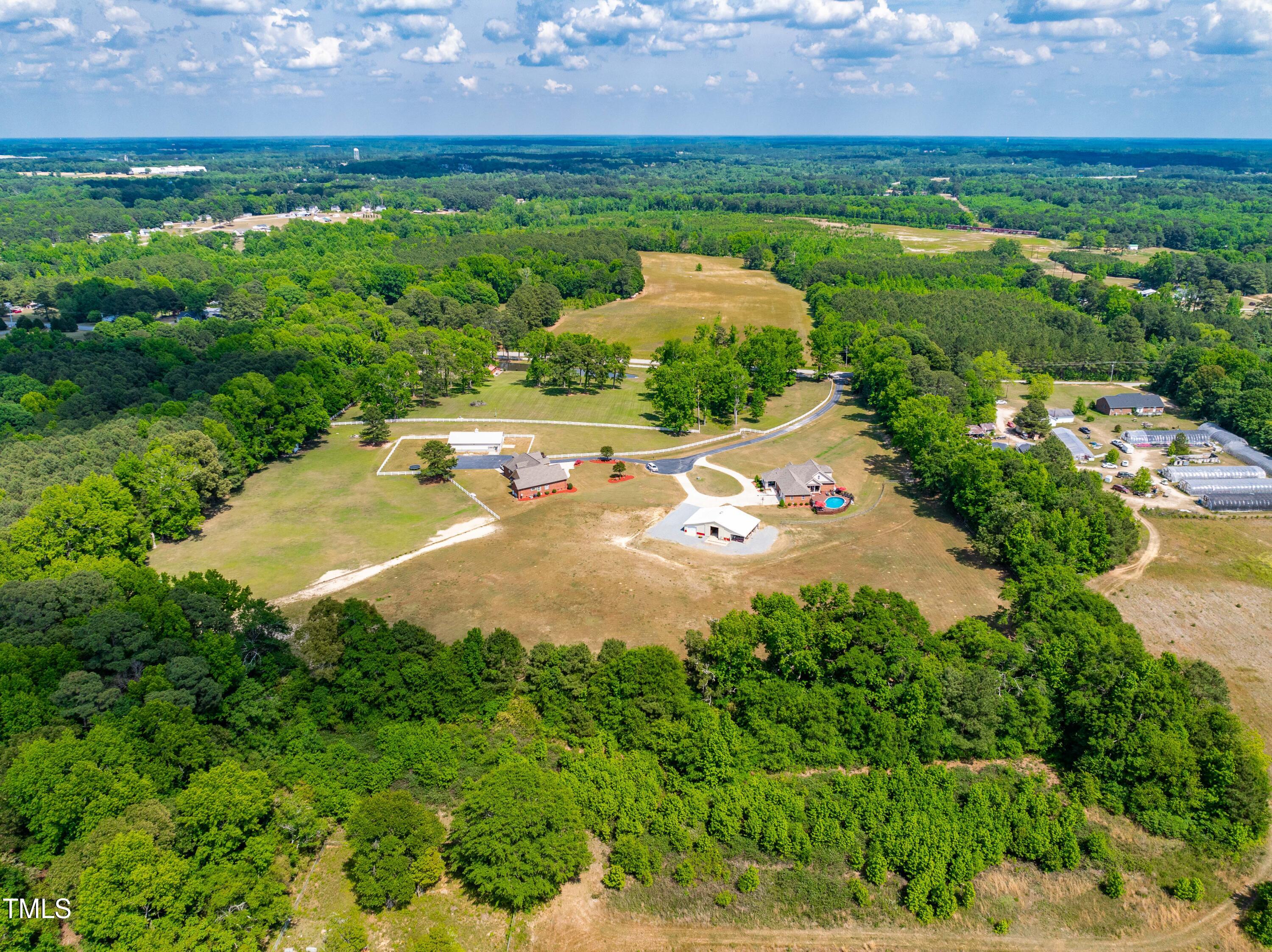 115 Three M Trail Benson, NC 27504 - Photo 72 of 80 an aerial view of a house with yard swimming pool and outdoor seating