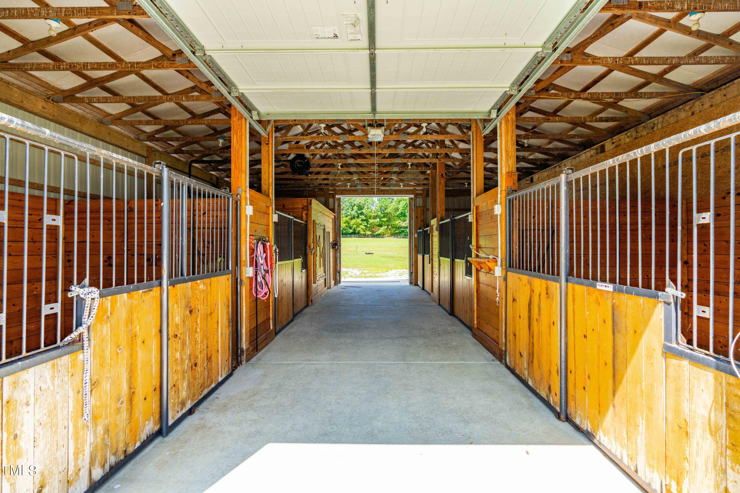 115 Three M Trail Benson, NC 27504 - Photo 74 of 80 a view of a porch with wooden floor and stairs