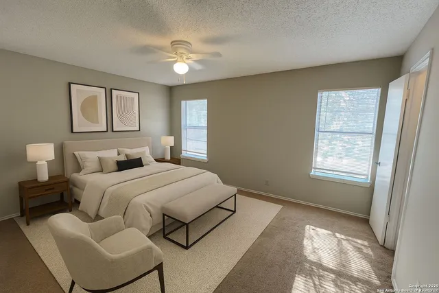a bedroom with bed and window