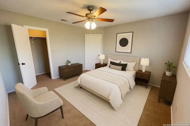 a bedroom with a bed and a chair