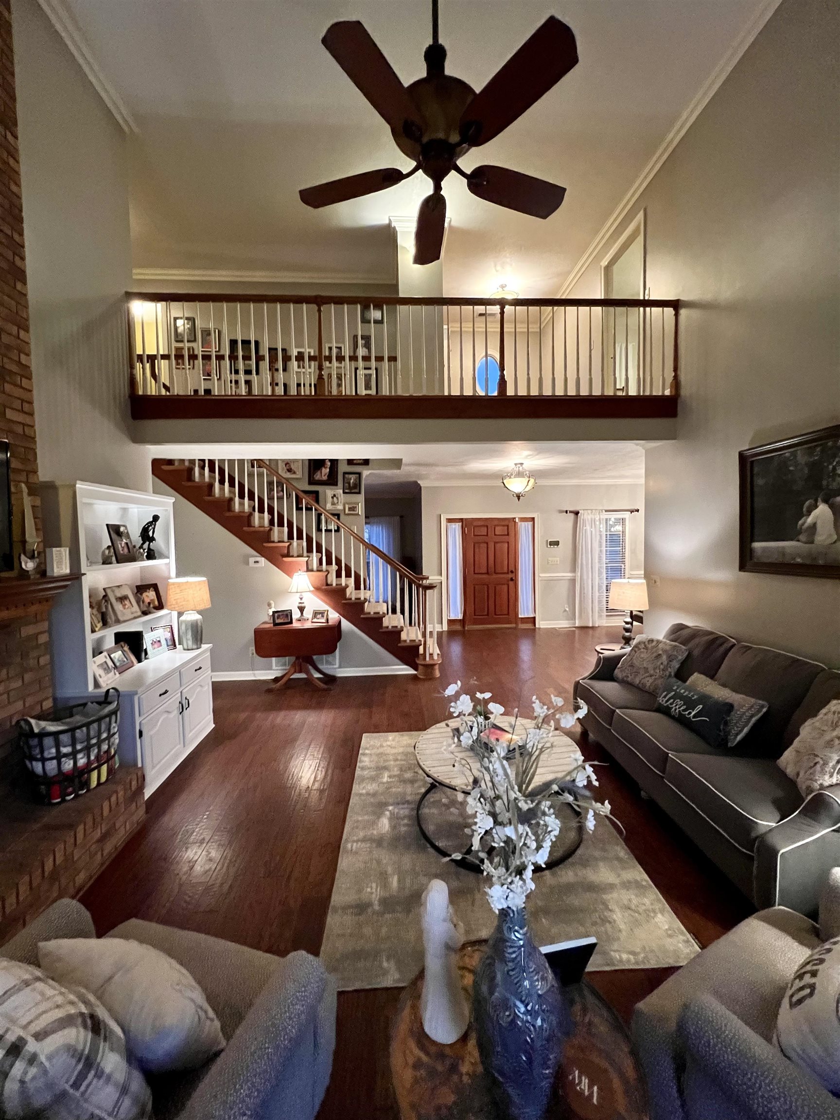 430 Belton Road Ripley, TN 38063 - Photo 7 of 25 a living room with furniture wooden floor and a book shelf