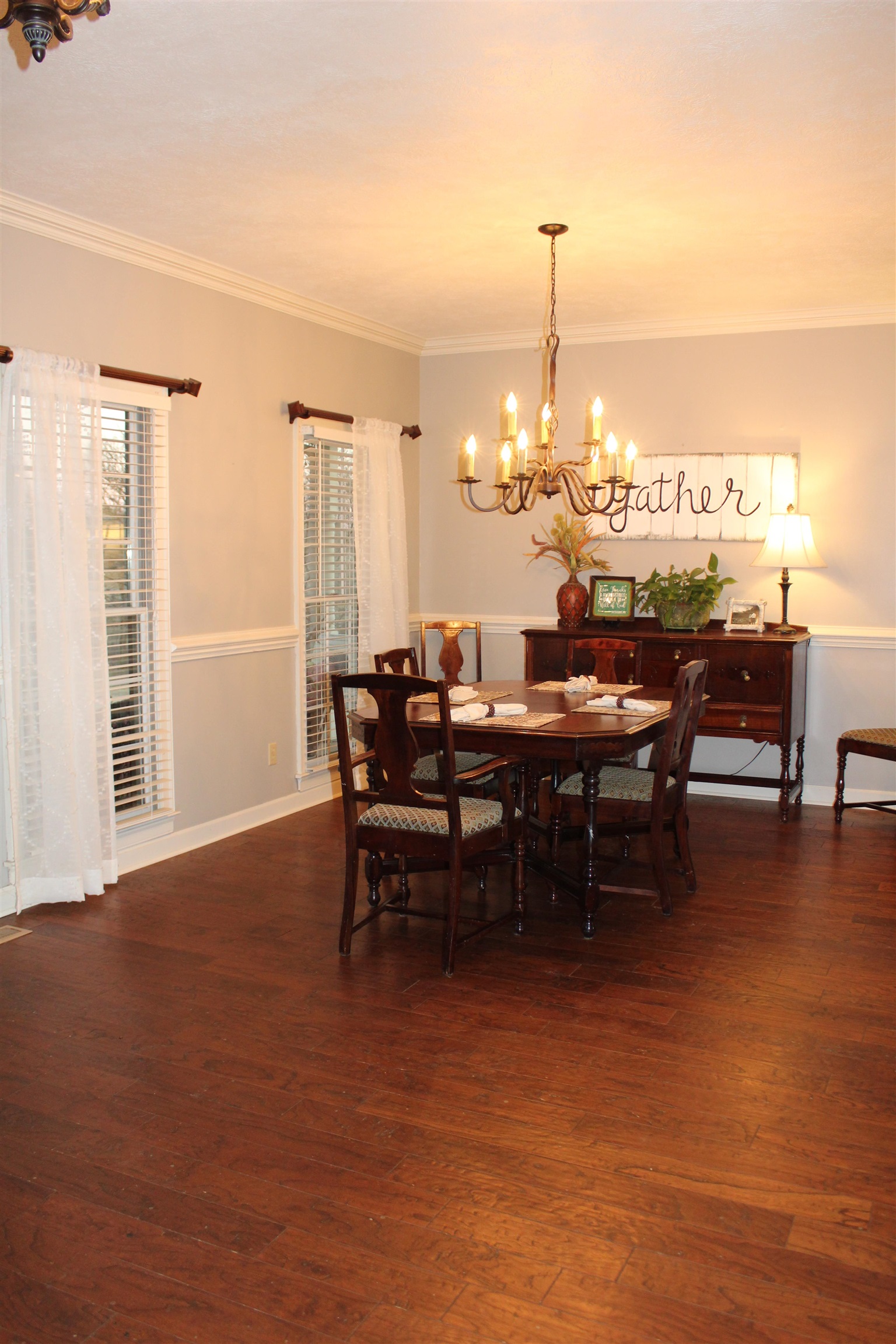 430 Belton Road Ripley, TN 38063 - Photo 8 of 25 a dining room with furniture a chandelier and wooden floor