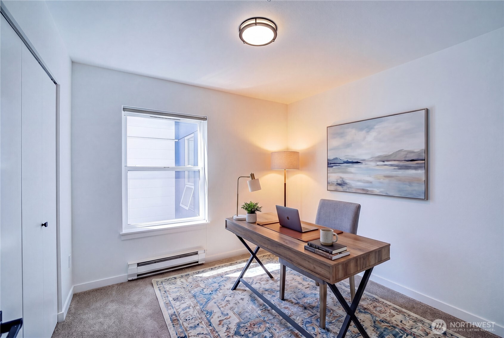 303 23rd Avenue South, Unit 506 Seattle, WA 98144 - Photo 17 of 36 a workspace with furniture and a window