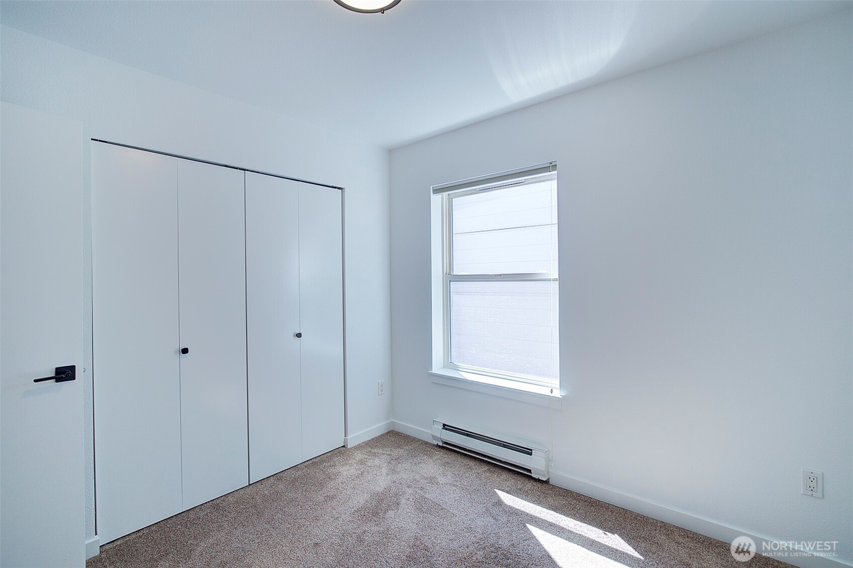 303 23rd Avenue South, Unit 506 Seattle, WA 98144 - Photo 18 of 36 a view of an empty room with a window