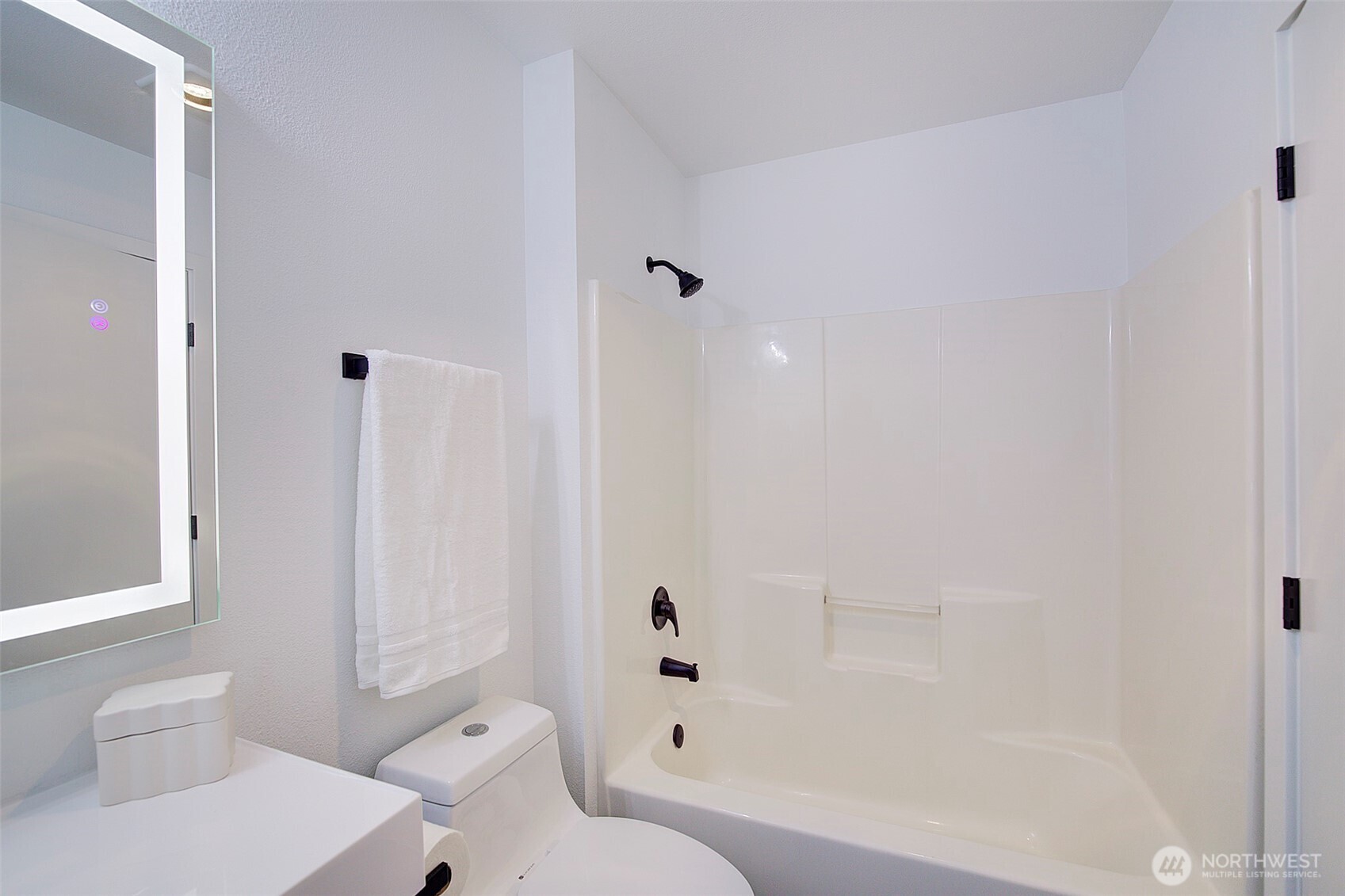303 23rd Avenue South, Unit 506 Seattle, WA 98144 - Photo 21 of 36 a bathroom with a toilet and shower