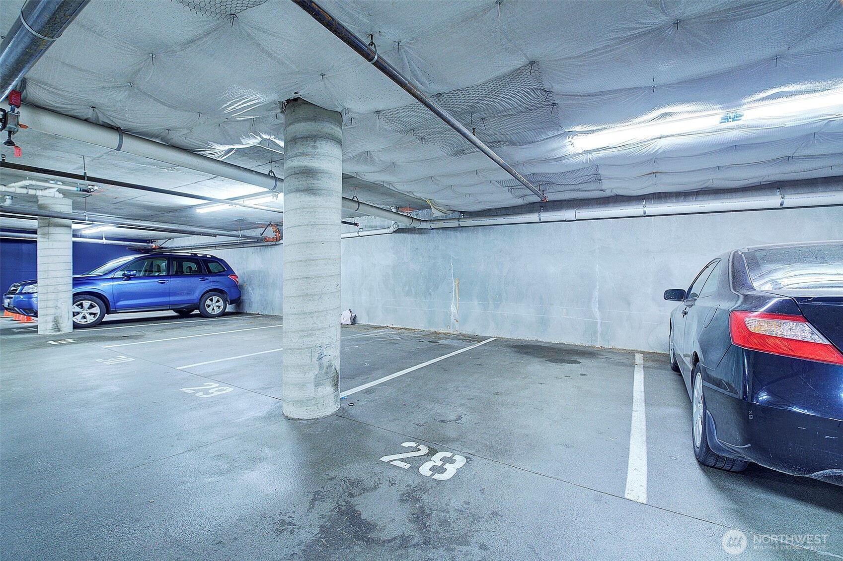 303 23rd Avenue South, Unit 506 Seattle, WA 98144 - Photo 32 of 36 a car parked in parking room