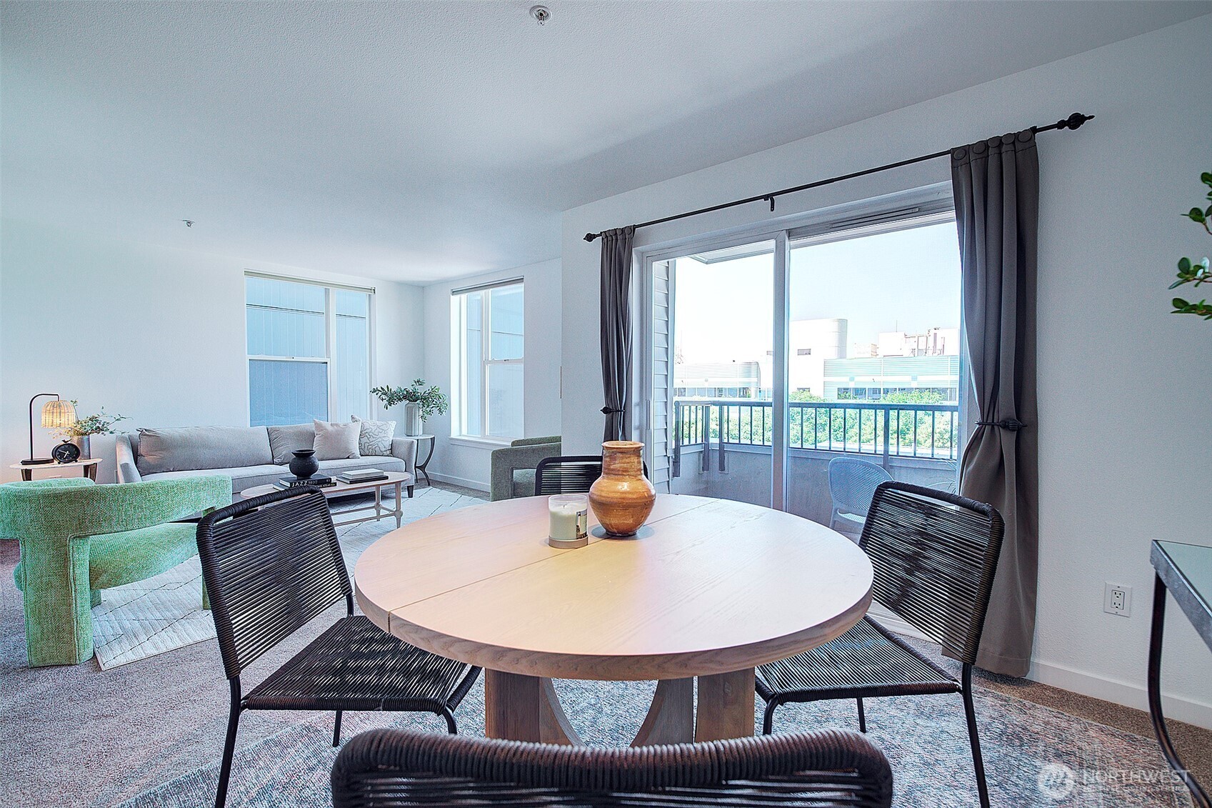 303 23rd Avenue South, Unit 506 Seattle, WA 98144 - Photo 9 of 36 a view of a dining room with furniture window and outside view