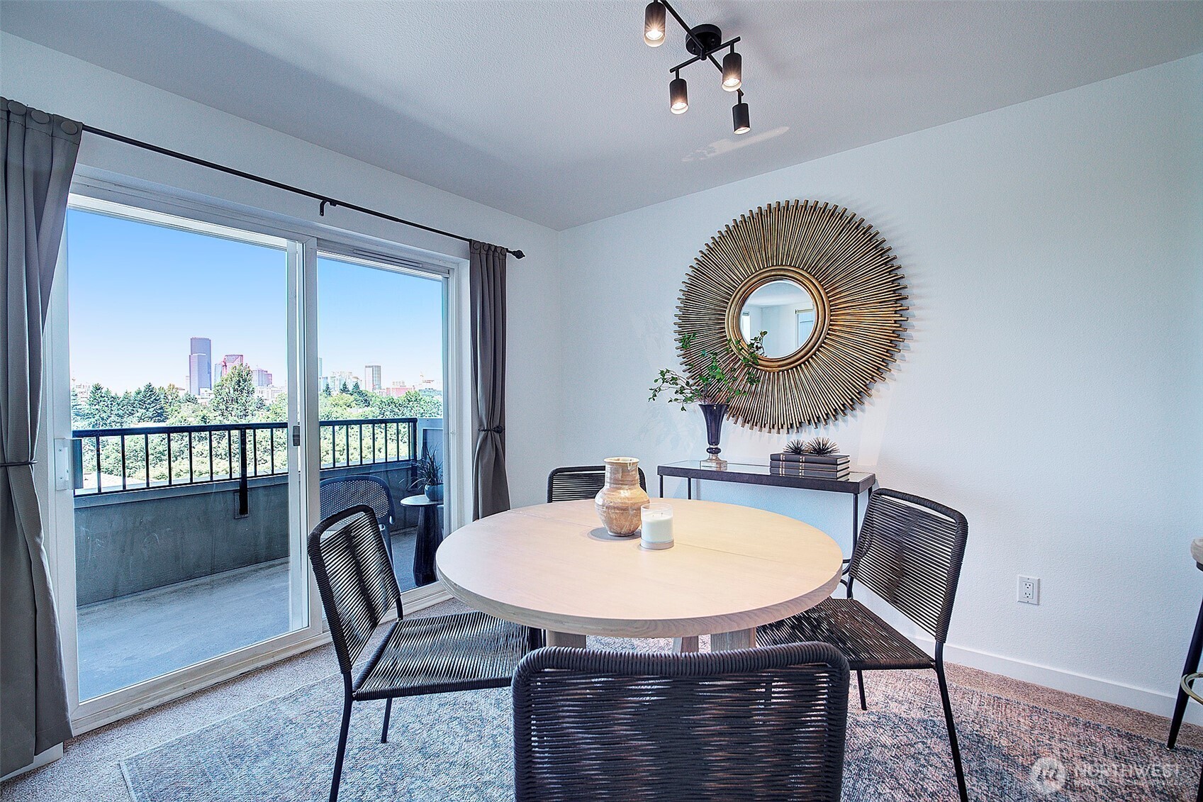 303 23rd Avenue South, Unit 506 Seattle, WA 98144 - Photo 10 of 36 a view of a dining room with a table and chairs