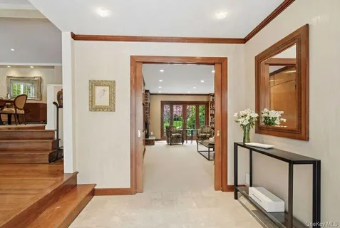 a view of a livingroom with wooden floor and furniture