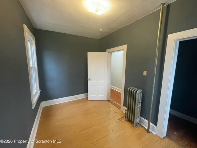 a view of livingroom with hallway and stairs