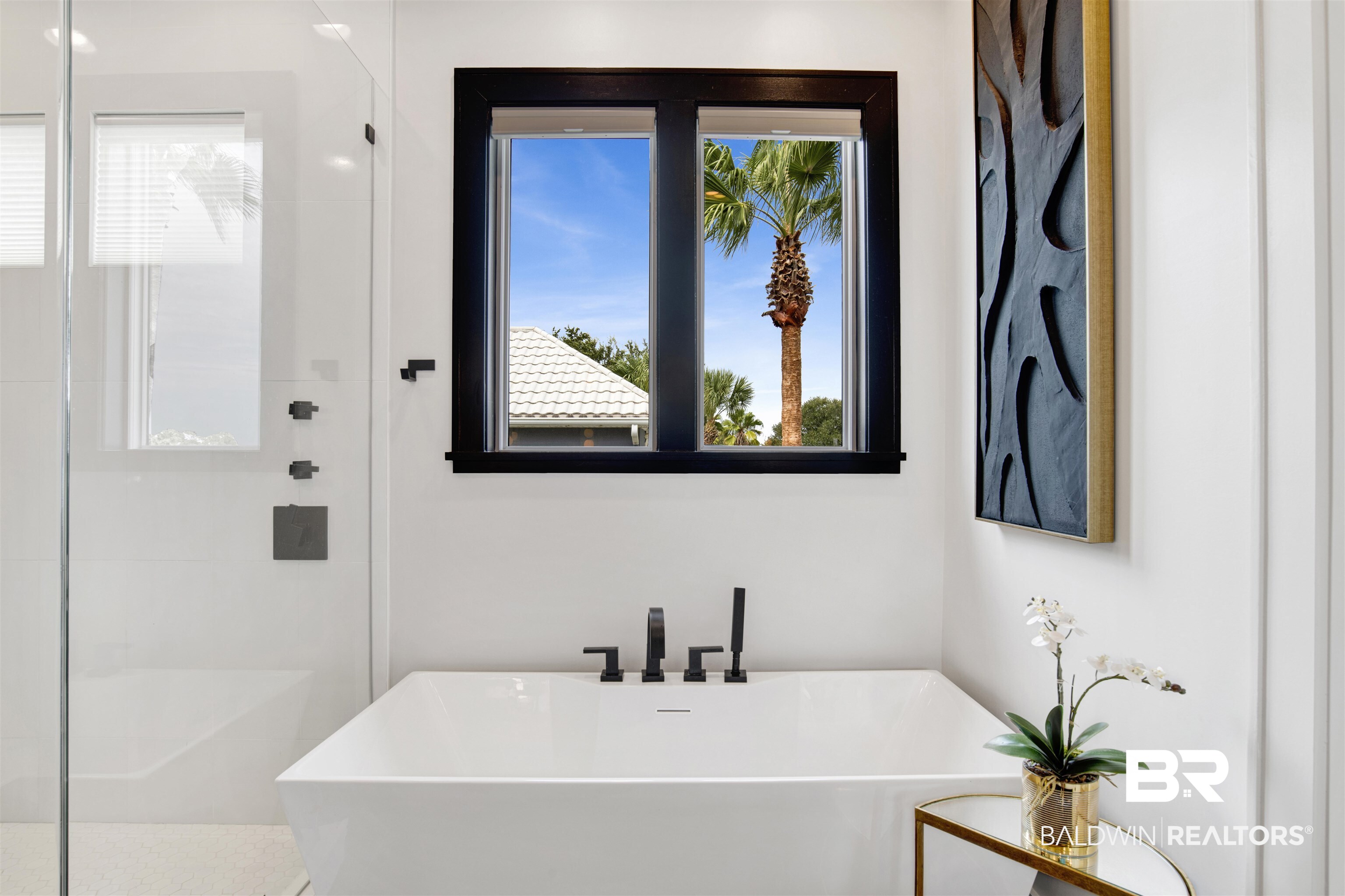 30239 Canal Court Orange Beach, AL 36561 - Photo 36 of 70 Bathroom featuring a shower stall, a freestanding tub, and healthy amount of natural light