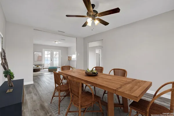 a dining room with furniture and window