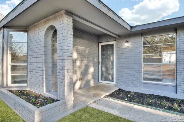 a front view of a house with windows