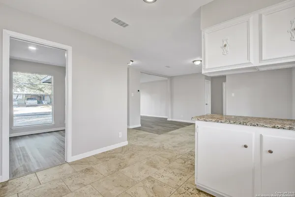a view of cabinets and window