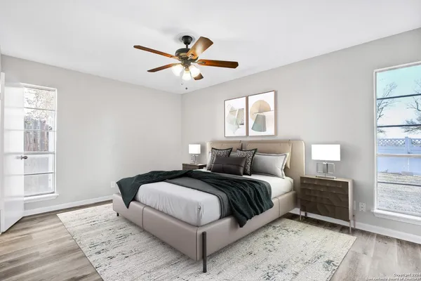 a bedroom with a large bed and a window