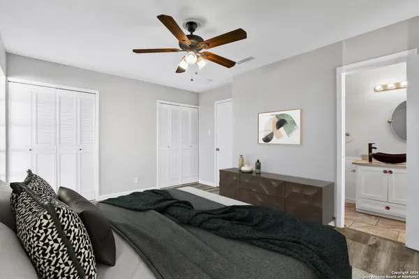 a bedroom with a bed and a dresser