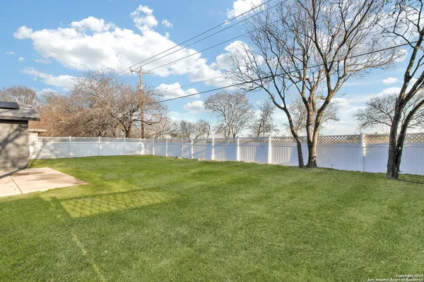 a view of yard with swimming pool