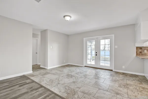 a view of an empty room with a window