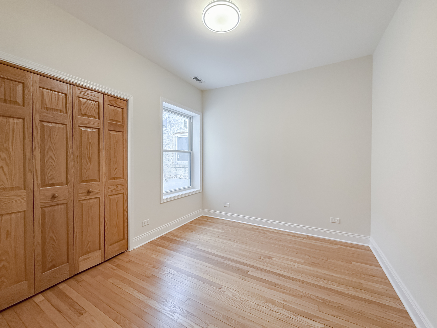 6411 West Irving Park Road, Unit 2 Chicago, IL 60634 - Photo 11 of 21 wooden floor in an empty room