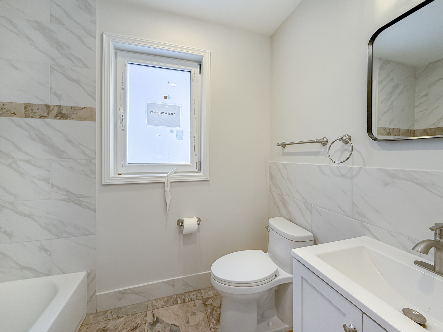 6411 West Irving Park Road, Unit 2 Chicago, IL 60634 - Photo 8 of 21 a bathroom with a sink toilet and vanity