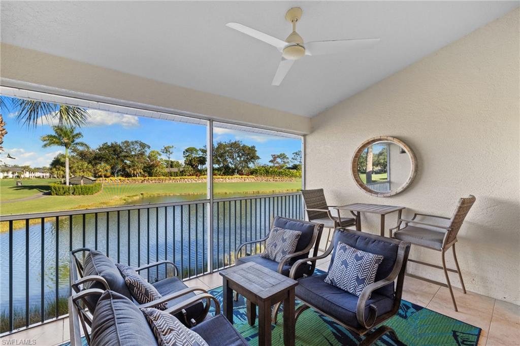 2215 Chesterbrook Court, Unit 2 Naples, FL 34109 - Photo 13 of 38 a living room with furniture a rug and a window