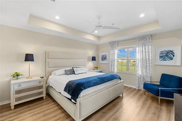 a bedroom with a bed and a chair