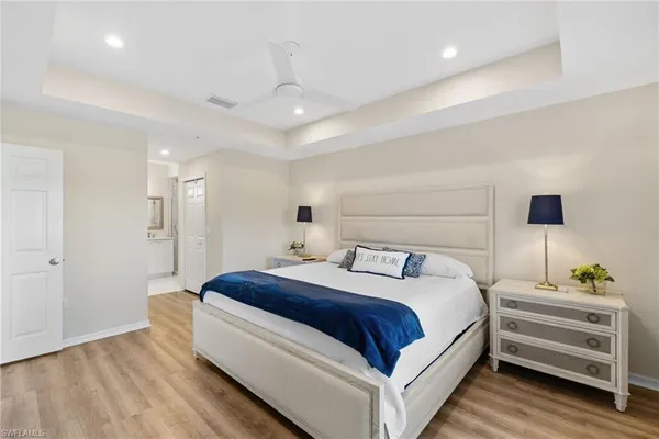 a bedroom with a bed and a night stand