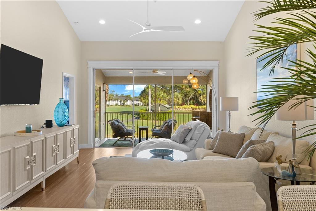 2215 Chesterbrook Court, Unit 2 Naples, FL 34109 - Photo 2 of 38 a living room with furniture and a flat screen tv