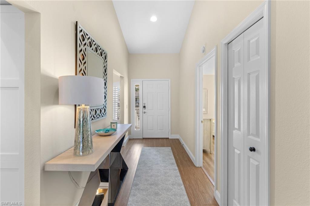 2215 Chesterbrook Court, Unit 2 Naples, FL 34109 - Photo 21 of 38 a view of a hallway to a livingroom with furniture