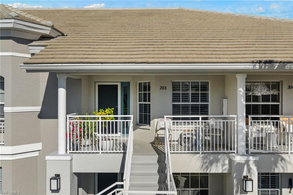 2215 Chesterbrook Court, Unit 2 Naples, FL 34109 - Photo 25 of 38 a view of a house with a deck