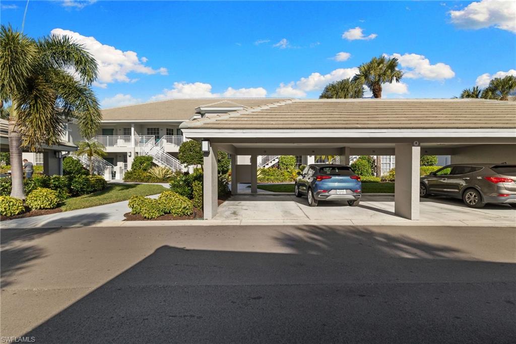 2215 Chesterbrook Court, Unit 2 Naples, FL 34109 - Photo 27 of 38 a couple of cars parked in front of a building