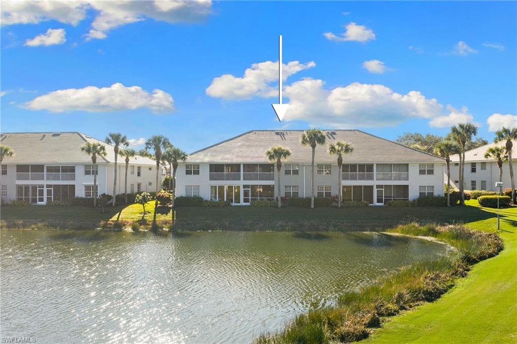 2215 Chesterbrook Court, Unit 2 Naples, FL 34109 - Photo 30 of 38 a view of a house with a yard