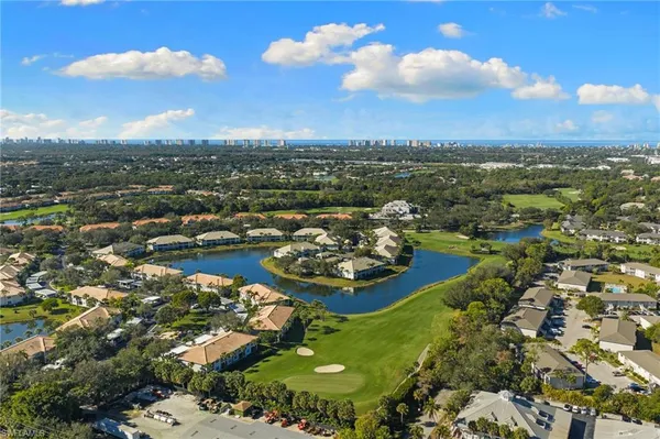 an aerial view of a residential houses with outdoor space