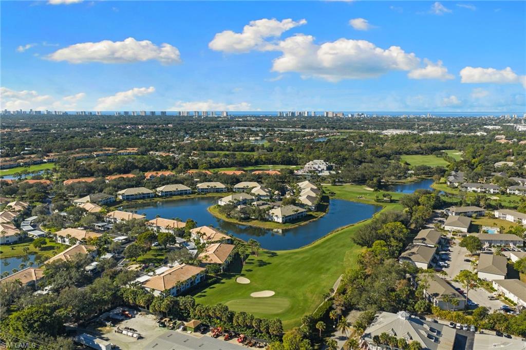 2215 Chesterbrook Court, Unit 2 Naples, FL 34109 - Photo 35 of 38 an aerial view of a residential houses with outdoor space