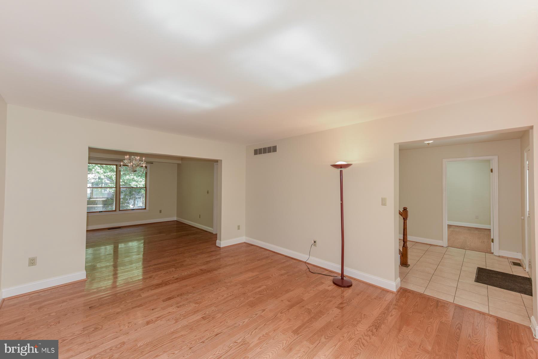 10541 Patuxent Ridge Way Laurel, MD 20723 - Photo 2 of 28 wooden floor in an empty room with a window