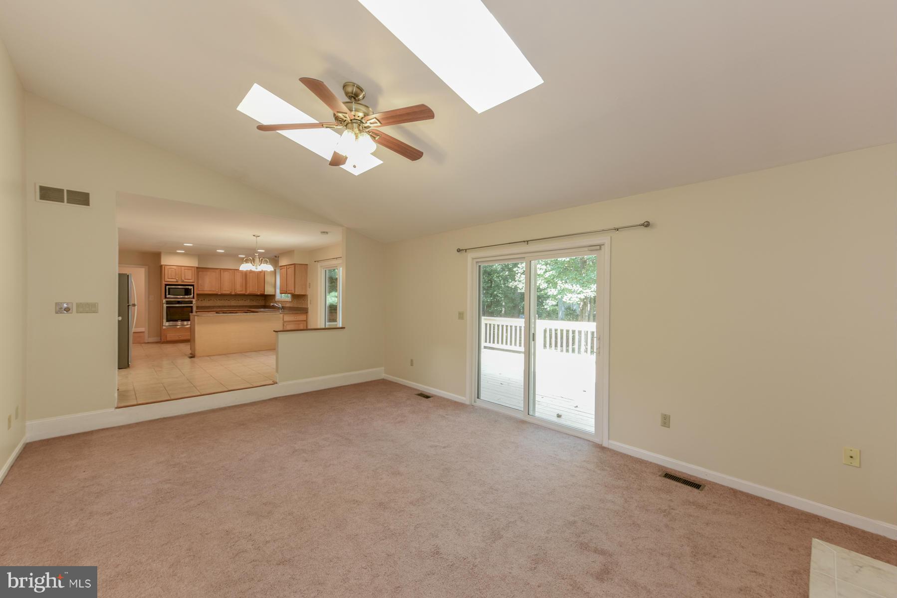 10541 Patuxent Ridge Way Laurel, MD 20723 - Photo 13 of 28 a view of a livingroom with a ceiling fan and window