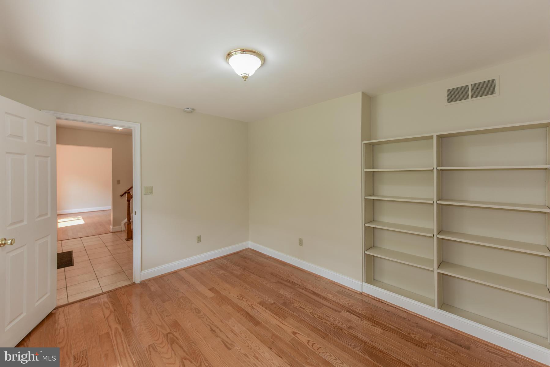 10541 Patuxent Ridge Way Laurel, MD 20723 - Photo 16 of 28 a view of empty room with wooden floor and fan