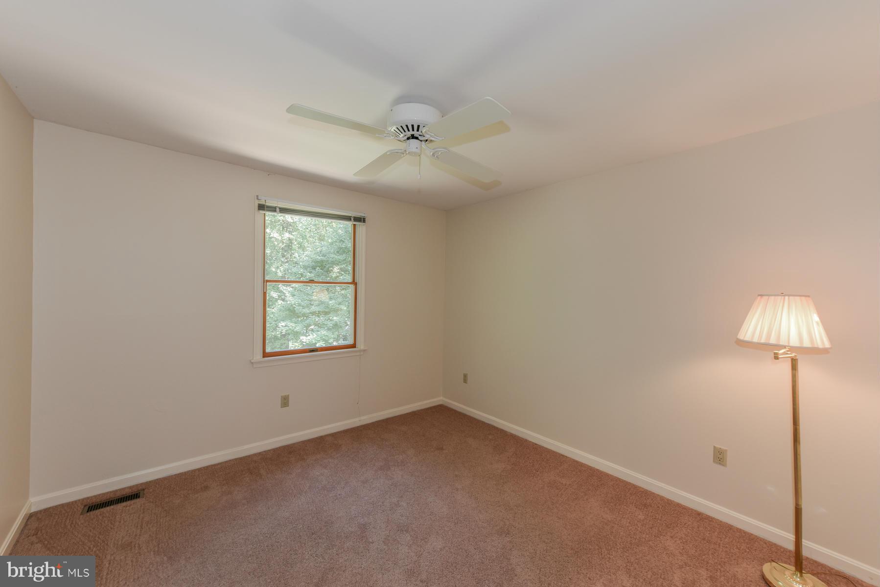 10541 Patuxent Ridge Way Laurel, MD 20723 - Photo 21 of 28 an empty room with a window and a fan