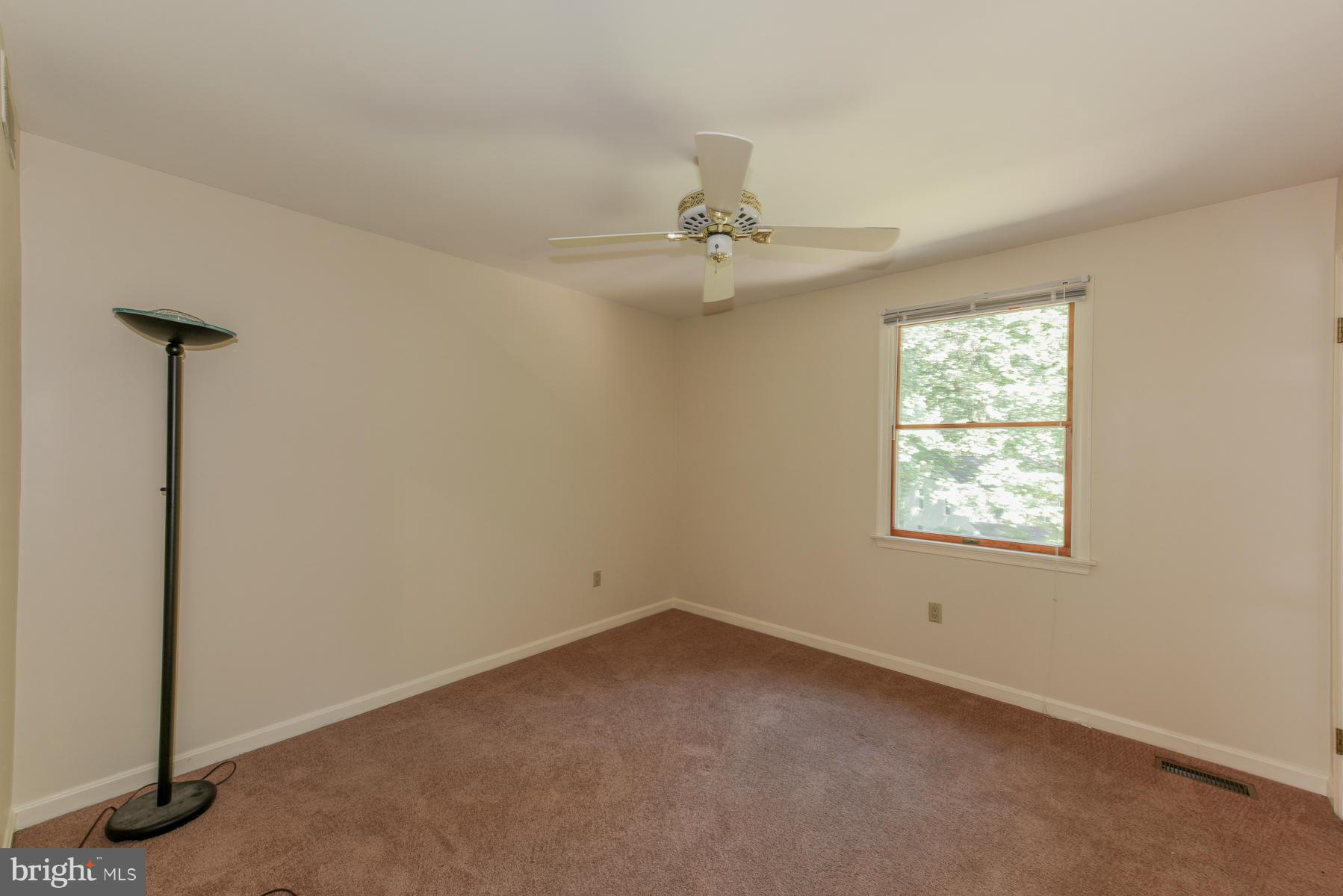 10541 Patuxent Ridge Way Laurel, MD 20723 - Photo 22 of 28 an empty room with windows and fan