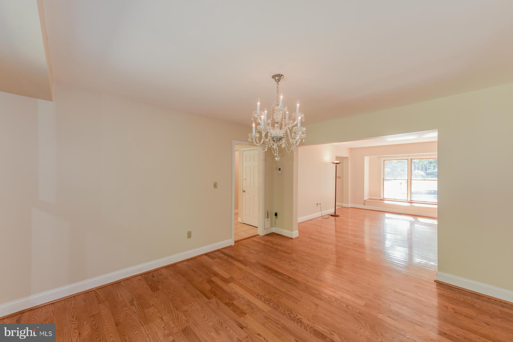 10541 Patuxent Ridge Way Laurel, MD 20723 - Photo 6 of 28 a view of an empty room with wooden floor and a window