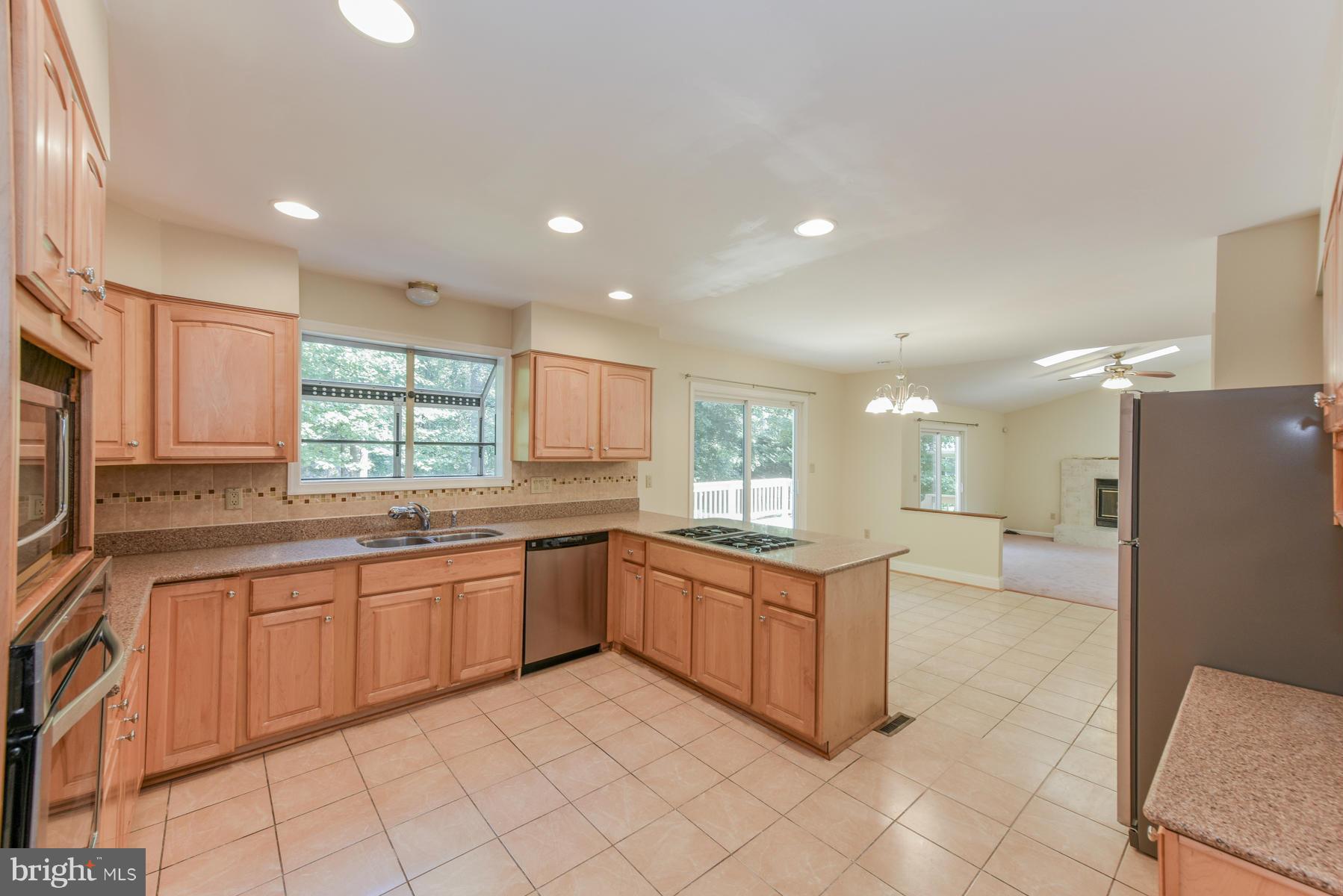 10541 Patuxent Ridge Way Laurel, MD 20723 - Photo 7 of 28 a large kitchen with lots of counter space and windows