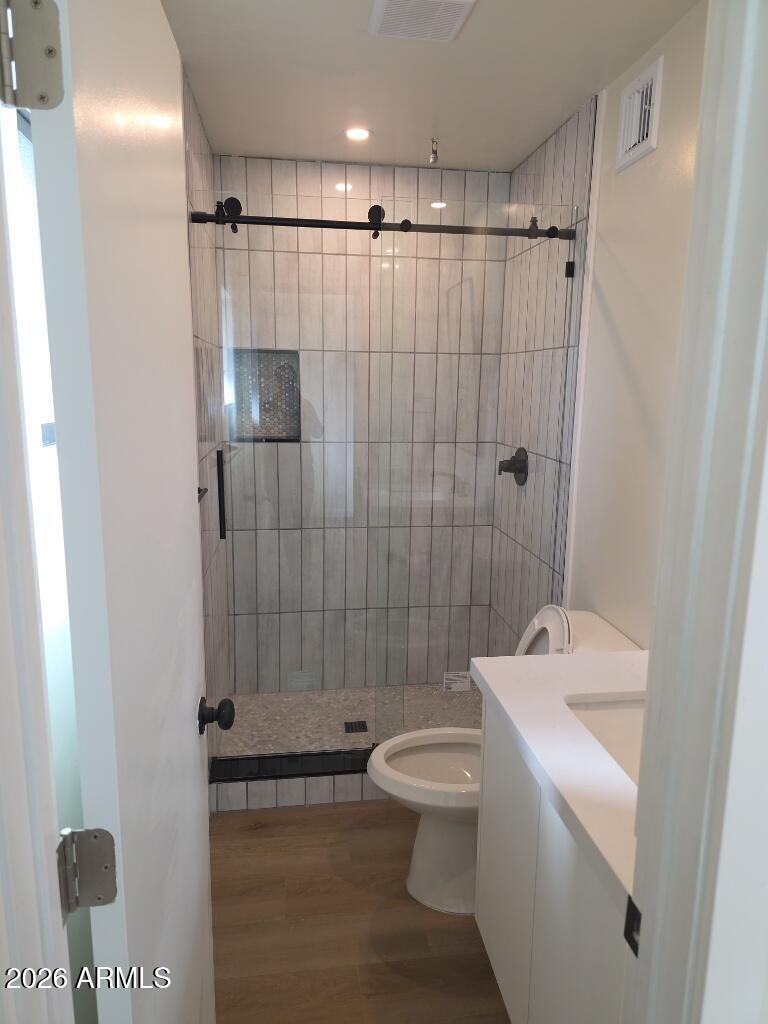 8015 West Roma Avenue Phoenix, AZ 85033 - Photo 11 of 15 a bathroom with a sink toilet and shower