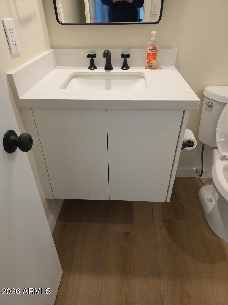 8015 West Roma Avenue Phoenix, AZ 85033 - Photo 12 of 15 a bathroom with a sink and a toilet
