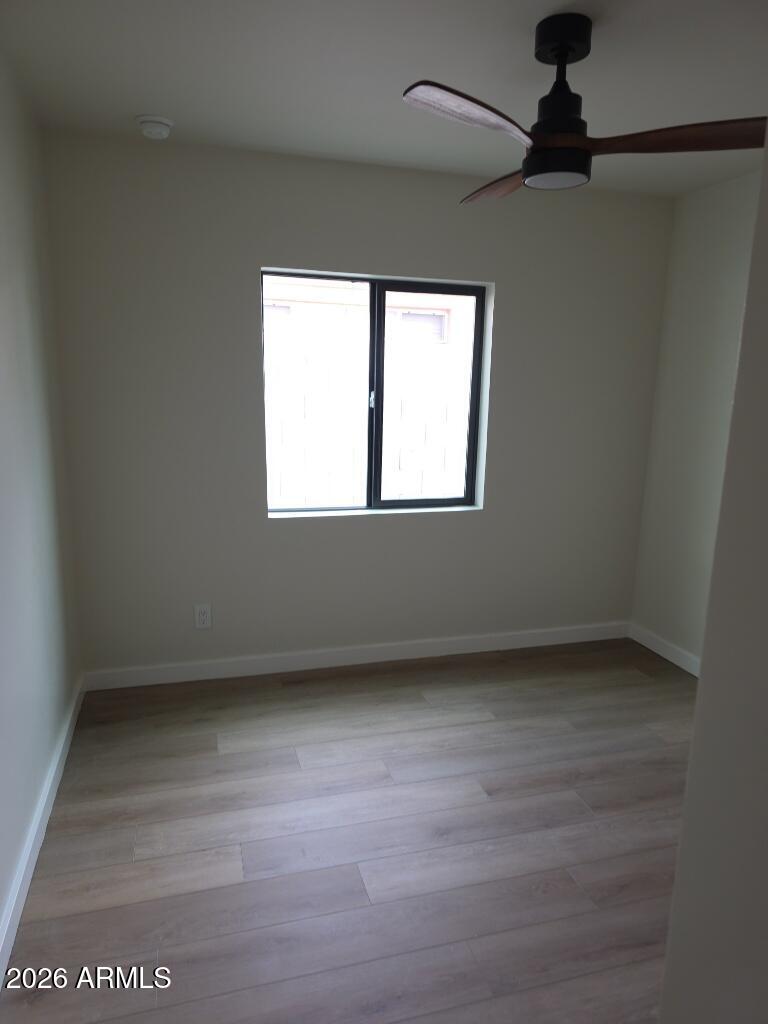 8015 West Roma Avenue Phoenix, AZ 85033 - Photo 7 of 15 a view of an empty room with a window