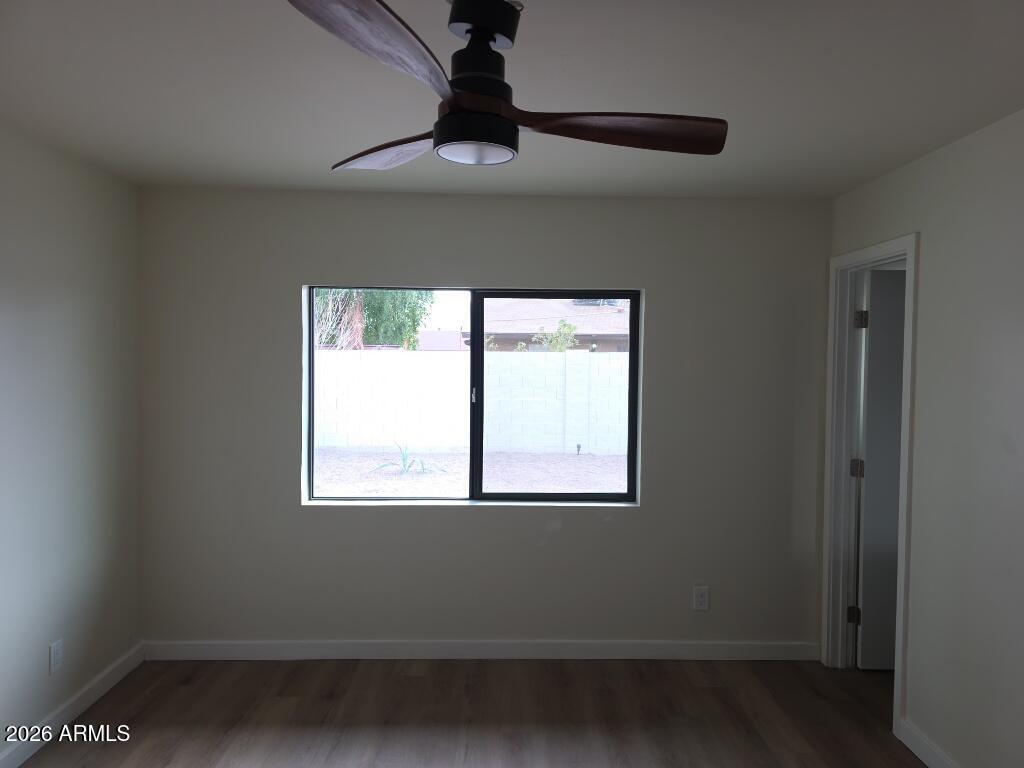 8015 West Roma Avenue Phoenix, AZ 85033 - Photo 9 of 15 a view of a room that has a window in it