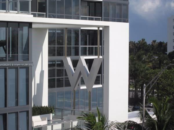200 23rd Street, Unit 203 Miami Beach, FL 33139 - Photo 32 of 79 a front view of a house with glass windows and yard
