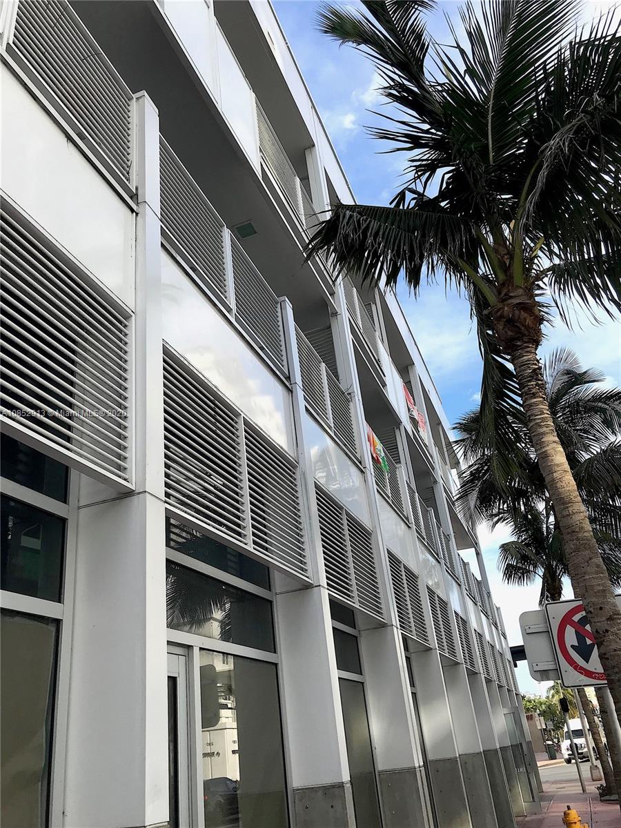 200 23rd Street, Unit 203 Miami Beach, FL 33139 - Photo 38 of 79 a view of many windows and a tree