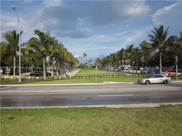 200 23rd Street, Unit 203 Miami Beach, FL 33139 - Photo 43 of 79 a view of a yard and car parked