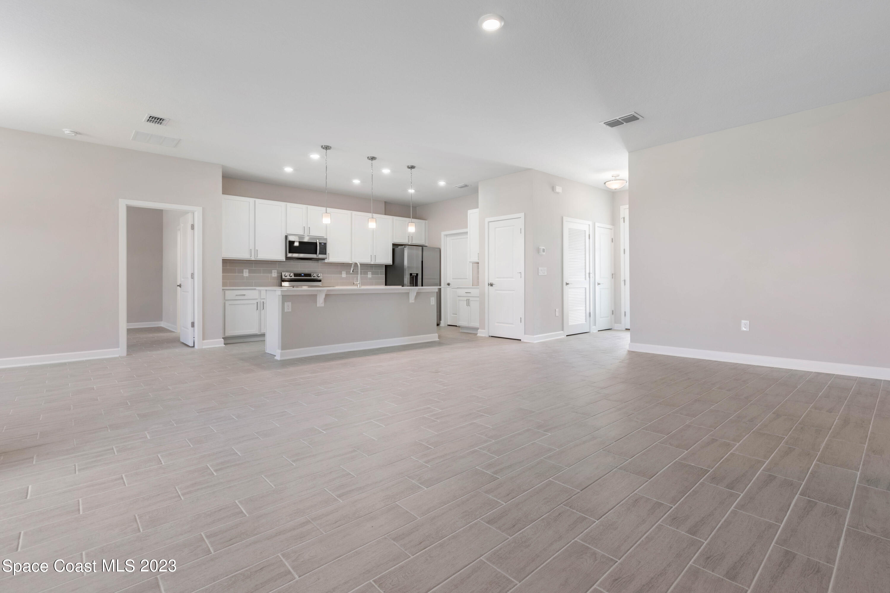 875 Clifton Road Southeast Palm Bay, FL 32909 - Photo 13 of 19 a view of a kitchen with a sink and a stove top oven